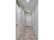 Hallway with tiled floor leads to interior rooms and the front door at 11121 Hudson Hills Ln, Riverview, FL 33579