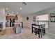 Open-concept kitchen with stainless steel appliances and a dining area, perfect for modern living and entertaining at 11121 Hudson Hills Ln, Riverview, FL 33579
