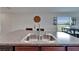 Kitchen sink with granite countertops and stainless steel faucet, offering a stylish and functional workspace at 11121 Hudson Hills Ln, Riverview, FL 33579