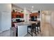 Kitchen with an island, granite countertops, wooden cabinets, stainless steel appliances, and a pantry at 11121 Hudson Hills Ln, Riverview, FL 33579
