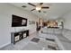 Open-concept living space with tile flooring, a large couch, and easy access to the kitchen at 11121 Hudson Hills Ln, Riverview, FL 33579