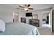 Spacious main bedroom with a ceiling fan, dresser, and doorways to other areas at 11121 Hudson Hills Ln, Riverview, FL 33579
