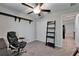Office with black rolling chair, wall shelves, and a closet at 11121 Hudson Hills Ln, Riverview, FL 33579