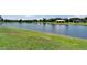 Scenic view of the pond with a gazebo, enhancing the community's charm at 11121 Hudson Hills Ln, Riverview, FL 33579