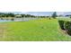 Expansive backyard overlooking a tranquil pond and a charming gazebo at 11121 Hudson Hills Ln, Riverview, FL 33579