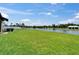 A backyard view showcasing a pond and a gazebo, creating a serene outdoor space at 11121 Hudson Hills Ln, Riverview, FL 33579