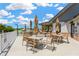 Outdoor patio with dining tables and umbrellas offers a relaxing space to enjoy the scenery at 11148 Hollander Ave, Hudson, FL 34667
