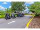 Golf carts parked outside the clubhouse provide a convenient way to enjoy the golf course at 11148 Hollander Ave, Hudson, FL 34667