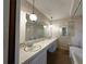 Bathroom showcasing a double sink vanity, large mirror, and ample counter space at 11198 58Th Ave, Seminole, FL 33772