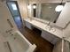 Bathroom featuring a double sink vanity, large mirror, and shower/tub combo at 11198 58Th Ave, Seminole, FL 33772