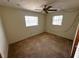 Bedroom with two windows and ceiling fan offering comfort and natural light at 11198 58Th Ave, Seminole, FL 33772