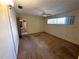 Spacious bedroom featuring a ceiling fan, window, and neutral walls at 11198 58Th Ave, Seminole, FL 33772