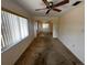 Bedroom with neutral walls, carpet, and a ceiling fan at 11198 58Th Ave, Seminole, FL 33772