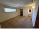 Bedroom with basic carpet and a view to the ensuite bathroom at 11198 58Th Ave, Seminole, FL 33772