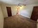 Bedroom with carpet, basic lighting, and doors to bathroom at 11198 58Th Ave, Seminole, FL 33772