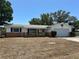 Charming single-story home featuring a combination brick and siding exterior, plus an attached garage and drought resistant yard at 11198 58Th Ave, Seminole, FL 33772