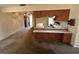 Open plan view of the kitchen counter overlooking the living area at 11198 58Th Ave, Seminole, FL 33772