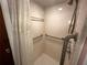 Tiled shower with grab bars and shower curtain for accessibility and comfort at 11198 58Th Ave, Seminole, FL 33772