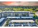A condo building with covered parking and a golf course view at 12300 Vonn Rd # 7107, Largo, FL 33774