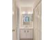 Bathroom featuring a vanity sink with storage, a mirror, and a closet with paneled doors at 12300 Vonn Rd # 7107, Largo, FL 33774