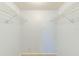 Bright, empty closet with two wire shelves, ready for storage and organization at 12300 Vonn Rd # 7107, Largo, FL 33774