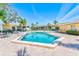 A sparkling pool with lounge chairs is surrounded by beautifully maintained landscaping at 12300 Vonn Rd # 7107, Largo, FL 33774