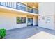 Building exterior showing doorway, windows, and concrete patio area at 12300 Vonn Rd # 7107, Largo, FL 33774