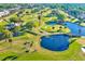 Picturesque aerial view of the golf course with serene ponds, winding pathways and beautifully manicured greens at 12300 Vonn Rd # 7107, Largo, FL 33774
