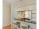 A kitchen bar with two chairs and a view into the kitchen at 12300 Vonn Rd # 7107, Largo, FL 33774