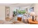 Inviting living room with plush seating, neutral decor, and sliding glass doors to outdoor space at 12300 Vonn Rd # 7107, Largo, FL 33774
