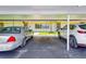 Designated covered parking spots near the condo building entrance at 12300 Vonn Rd # 7107, Largo, FL 33774