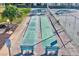 Outdoor shuffleboard courts with benches, nestled among lush landscaping at 12300 Vonn Rd # 7107, Largo, FL 33774