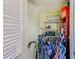 Storage space with bikes, shelving and various household items neatly organized at 12300 Vonn Rd # 7107, Largo, FL 33774