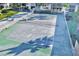 View of an outdoor tennis court in an active community setting with greenery at 12300 Vonn Rd # 7107, Largo, FL 33774