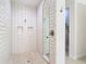 Modern bathroom features a glass shower enclosure with white subway tile and hexagon tile flooring at 13706 Osprey Fern Ln, Riverview, FL 33569
