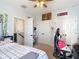 Bright bedroom with a ceiling fan and dual closets, perfect for storage at 13706 Osprey Fern Ln, Riverview, FL 33569