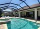 Relaxing screened-in pool and patio area, perfect for enjoying the outdoors at 13706 Osprey Fern Ln, Riverview, FL 33569