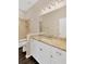 Bright bathroom featuring a granite countertop, white cabinets, and a glass-enclosed shower at 13872 Siena Loop, Lakewood Ranch, FL 34202