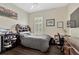 Neutral bedroom with hardwood floors and furniture, offering a calming atmosphere at 13872 Siena Loop, Lakewood Ranch, FL 34202