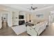 Spacious living room features a recessed media center and a comfortable, neutral sectional sofa at 13872 Siena Loop, Lakewood Ranch, FL 34202