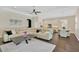 Open floor plan showcases living, dining, and kitchen areas, featuring hardwood floors and neutral decor at 13872 Siena Loop, Lakewood Ranch, FL 34202
