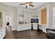 Home office boasts custom built-ins, providing ample storage and workspace with natural light at 13872 Siena Loop, Lakewood Ranch, FL 34202