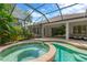 Screened-in pool with attached spa provides the perfect spot to unwind and enjoy the outdoors at 13872 Siena Loop, Lakewood Ranch, FL 34202