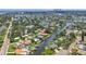 Aerial view showing the property's waterfront location, with a canal leading to the bay and Gulf beyond at 1449 45Th Ne Ave, St Petersburg, FL 33703