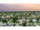 Expansive neighborhood aerial view highlights the waterfront community with lush trees and nearby canal access at 1449 45Th Ne Ave, St Petersburg, FL 33703