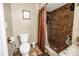 Bathroom featuring a toilet and a tiled walk-in shower at 1449 45Th Ne Ave, St Petersburg, FL 33703