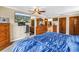 Bedroom with a ceiling fan, television, and plush carpeting at 1449 45Th Ne Ave, St Petersburg, FL 33703