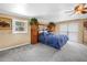 Cozy bedroom featuring a ceiling fan, neutral walls, and plush carpeting at 1449 45Th Ne Ave, St Petersburg, FL 33703