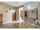 Bedroom with tile floors and an adjoined bathroom at 1449 45Th Ne Ave, St Petersburg, FL 33703