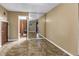 Bedroom with tile floors and an adjoined bathroom at 1449 45Th Ne Ave, St Petersburg, FL 33703